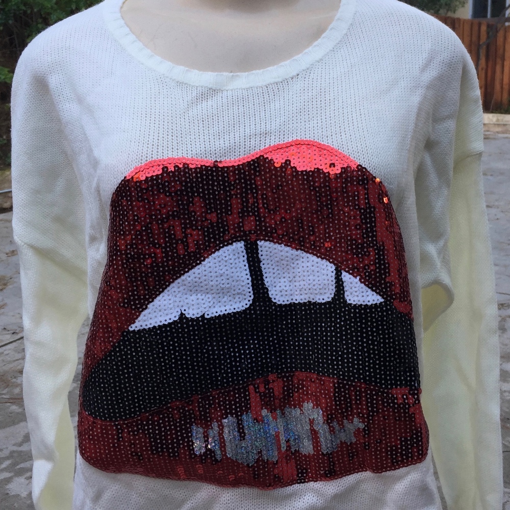 White sweater sequined lips